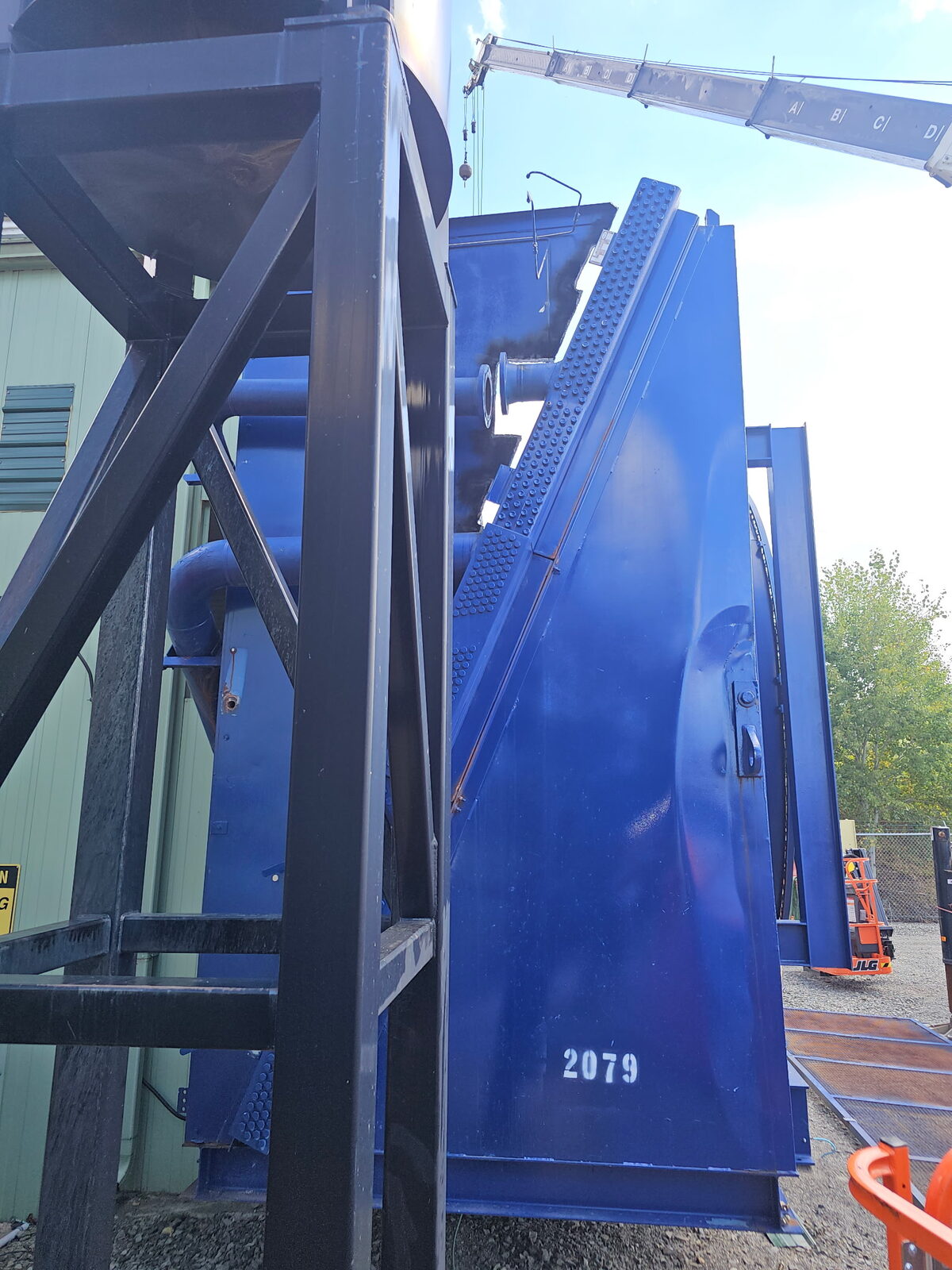 Compressor cooler section staged for crane lift